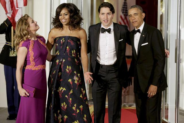 US President Barack Obama and first lady Michelle Obama welcome Canada's Prime Minister Justin Trudeau and his wife Sophie Gregoire-Trudeau as they arrive for a state dinner at the White House. (Reuters Photo) US President Barack Obama and first lady Michelle Obama welcome Canada's Prime Minister Justin Trudeau and his wife Sophie Gregoire-Trudeau as they arrive for a state dinner at the White House. (Reuters Photo)