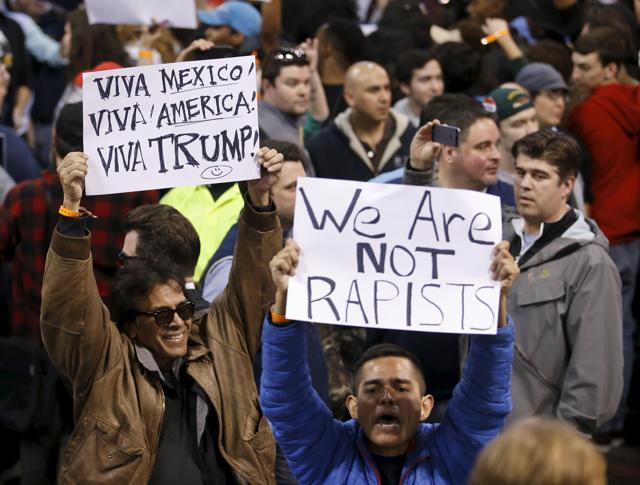 Demonstrators hold boards ahead of the rally in Chicago, which was later cancelled. (REUTERS)