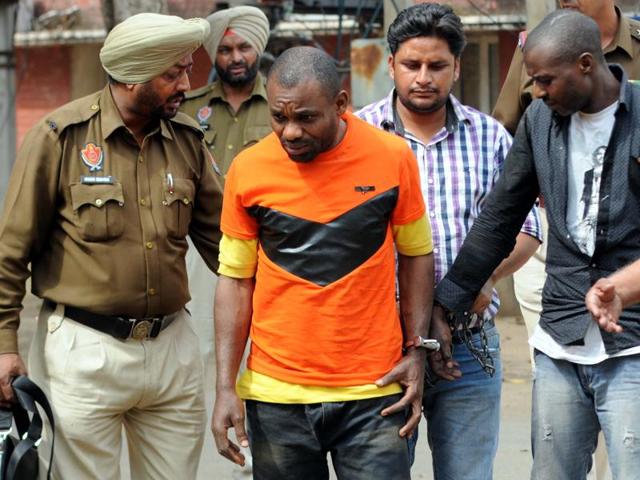 Accused Stanely (left) and Festus Ugochukwu from Nigeria in police custody in Patiala on Friday. (Bharat Bhushan/HT Photo) Accused Stanely (left) and Festus Ugochukwu from Nigeria in police custody in Patiala on Friday. (Bharat Bhushan/HT Photo)