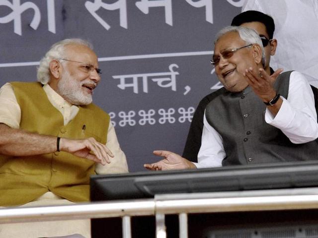 Prime Minister Narendra Modi with Bihar Chief Minister Nitish Kumar during inaugural function of Digha-Sonepur rail-cum-road bridge in Hajipur on Saturday. (PTI) Prime Minister Narendra Modi with Bihar Chief Minister Nitish Kumar during inaugural function of Digha-Sonepur rail-cum-road bridge in Hajipur on Saturday. (PTI)