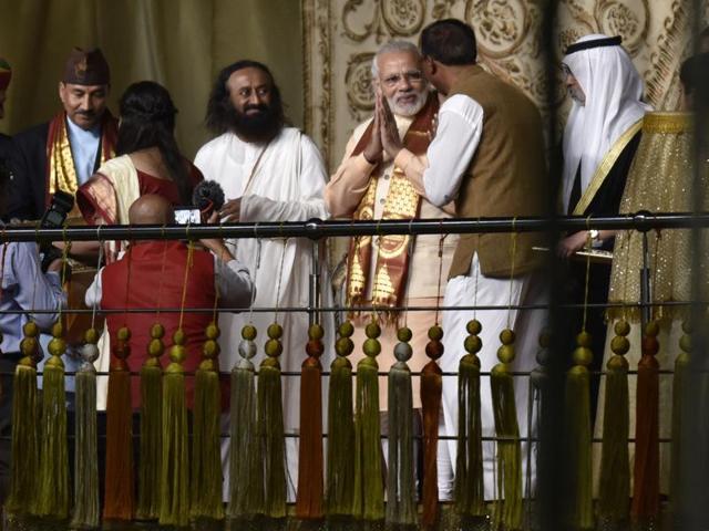 Prime Minister Narendra Modi and Sri Sri Ravi shankar interact with other guests during the inaugural session of the World Culture Festival in New Delhi. (Virendra Singh Gosain/HT Photo) Prime Minister Narendra Modi and Sri Sri Ravi shankar interact with other guests during the inaugural session of the World Culture Festival in New Delhi. (Virendra Singh Gosain/HT Photo)