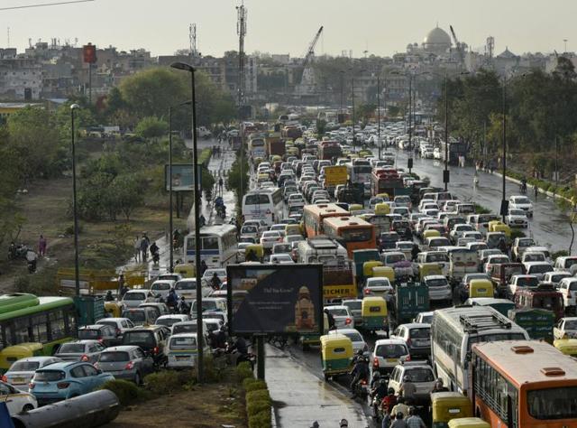 Delhi descended into a traffic chaos on Friday, March 11, 2016, thanks to an Art of Living event, a religious gathering, 20,000 weddings and a spell of rain. (Ravi Choudhary / HT Photo) Delhi descended into a traffic chaos on Friday, March 11, 2016, thanks to an Art of Living event, a religious gathering, 20,000 weddings and a spell of rain. (Ravi Choudhary / HT Photo)