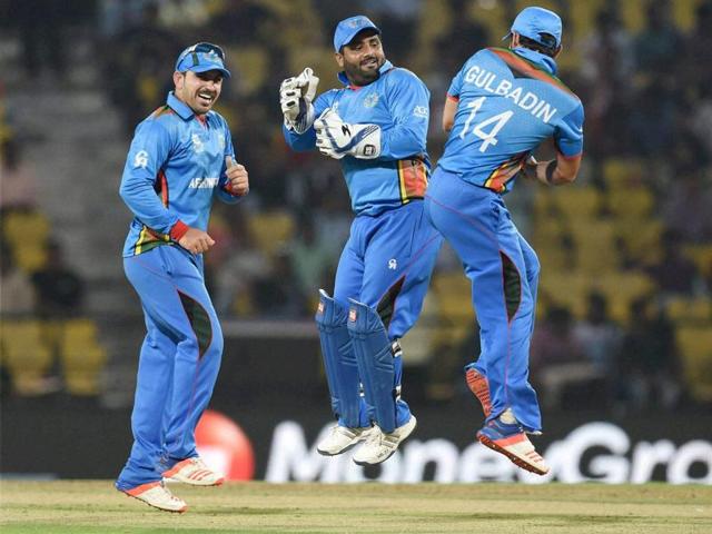 Afghanistan players celebrate their victory against Zimbabwe in the ICC T20 World Cup match in Nagpur on Saturday. (PTI Photo) Afghanistan players celebrate their victory against Zimbabwe in the ICC T20 World Cup match in Nagpur on Saturday. (PTI Photo)