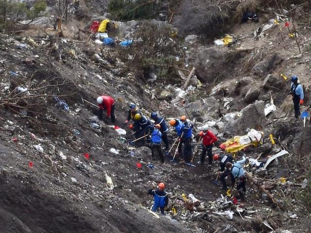 French gendarmes and investigators work in the scattered debris on the crash site of the Germanwings Airbus A320 in the French Alps. (AFP File Photo) French gendarmes and investigators work in the scattered debris on the crash site of the Germanwings Airbus A320 in the French Alps. (AFP File Photo)