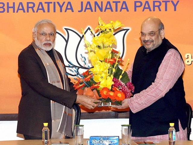 Prime Minister Narendra Modi greets Amit Shah for being re-elected as BJP President. (PTI Photo) Prime Minister Narendra Modi greets Amit Shah for being re-elected as BJP President. (PTI Photo)