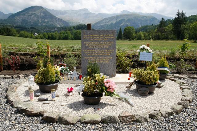 A stone slab erected as a monument, set up in the area near where a Germanwings aircraft crashed in the French Alps, in Le Vernet, French Alps. (AP File Photo) A stone slab erected as a monument, set up in the area near where a Germanwings aircraft crashed in the French Alps, in Le Vernet, French Alps. (AP File Photo)