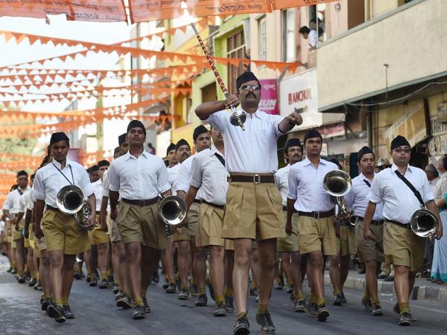 This file photo shows members of Rashtriya Swayamsevak Sangh marching in the organisation’s trademark khaki shorts.(AFP Photo)