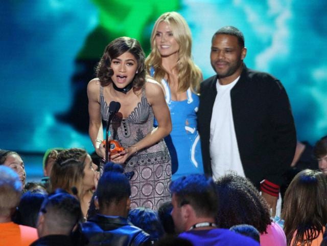 Zendaya accepts the award for favourite female TV Star - kids' show for her role as K.C. Cooper in KC Undercover from Heidi Klum and Anthony Anderson. (Matt Sayles/Invision/AP) Zendaya accepts the award for favourite female TV Star - kids' show for her role as K.C. Cooper in KC Undercover from Heidi Klum and Anthony Anderson. (Matt Sayles/Invision/AP)