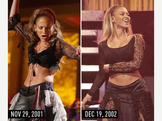 Black crop top with sheer sleeves, black bottoms, and pulled-back hair: JLo performing at the Onda Music Awards on Nov 29, 2001. Beyonce performing on Dec 19, 2002. (Pinterest) Black crop top with sheer sleeves, black bottoms, and pulled-back hair: JLo performing at the Onda Music Awards on Nov 29, 2001. Beyonce performing on Dec 19, 2002. (Pinterest)
