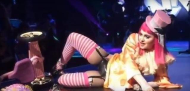The singer fell off a tricycle she was riding onstage during an act. (YouTube Grab)