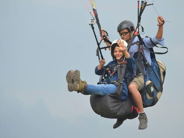 A woman enjoys paragliding at Bir Billing in Kangra district of Himachal Pradesh. (Jugni) A woman enjoys paragliding at Bir Billing in Kangra district of Himachal Pradesh. (Jugni)