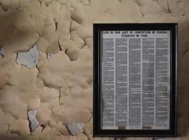 Rules, written in Konkani, hang by a flaky wall inside the Club of Paroda in Matharpacady, Mazgaon. Members of every kudd follow a similar set of rules — the daily evening rosary is compulsory, bedding must be rolled up by 8 am, lights must go out by 10.30 pm. Drinking is allowed as long as no nuisance is created, and most kudds allow card games on certain days. (Arijit Sen/ Hindustan Times) Rules, written in Konkani, hang by a flaky wall inside the Club of Paroda in Matharpacady, Mazgaon. Members of every kudd follow a similar set of rules — the daily evening rosary is compulsory, bedding must be rolled up by 8 am, lights must go out by 10.30 pm. Drinking is allowed as long as no nuisance is created, and most kudds allow card games on certain days. (Arijit Sen/ Hindustan Times)
