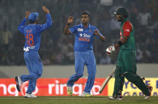 Ravichandran Ashwin, center, celebrates with his teammate Virat Kohli after the dismissal of Bangladesh’s Imrul Kayes, unseen, during the Asia Cup Twenty20 in Dhaka. (AP Photo) Ravichandran Ashwin, center, celebrates with his teammate Virat Kohli after the dismissal of Bangladesh’s Imrul Kayes, unseen, during the Asia Cup Twenty20 in Dhaka. (AP Photo)