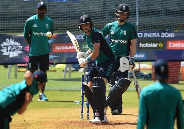 England batsman Joe Root (C) prepares to play a shot as captain Eoin Morgan (R) watches during a training session at Wankhede Stadium in Mumbai. (AFP Photo) England batsman Joe Root (C) prepares to play a shot as captain Eoin Morgan (R) watches during a training session at Wankhede Stadium in Mumbai. (AFP Photo)