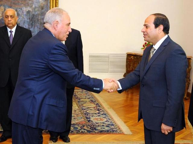 A file picture from 2015 shows Egyptian President Abdel Fattah al-Sisi (right) shaking hands with justice minister Ahmed al-Zind during his swearing-in ceremony in Cairo. (AFP File Photo) A file picture from 2015 shows Egyptian President Abdel Fattah al-Sisi (right) shaking hands with justice minister Ahmed al-Zind during his swearing-in ceremony in Cairo. (AFP File Photo)