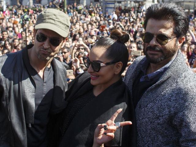 Indian actors Hrithik Roshan, Sonakshi Sinha and Anil Kapoor pose as they take part in a flashmob in Madrid to promote IIFA to take place Madrid in June.  (REUTES) 