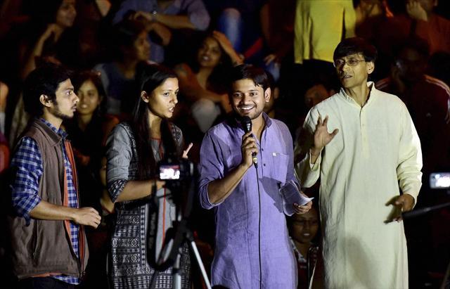 JNUSU president Kanhaiya Kumar, flanked by vice president Shehla Rashid (2nd L) and Rama Naga (L), addresses students on the JNU campus in New Delhi. (PTI) JNUSU president Kanhaiya Kumar, flanked by vice president Shehla Rashid (2nd L) and Rama Naga (L), addresses students on the JNU campus in New Delhi. (PTI)
