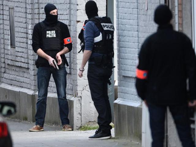 Police officers take position at the site of a shooting in the southern Forest district of Brussels. (AFP Photo) Police officers take position at the site of a shooting in the southern Forest district of Brussels. (AFP Photo)