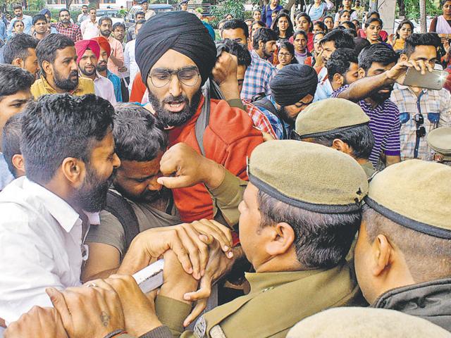 Students clashing with police personnel during the protest against fee hike outside the administrative block at Panjab University on Monday. (HT Photo) Students clashing with police personnel during the protest against fee hike outside the administrative block at Panjab University on Monday. (HT Photo)