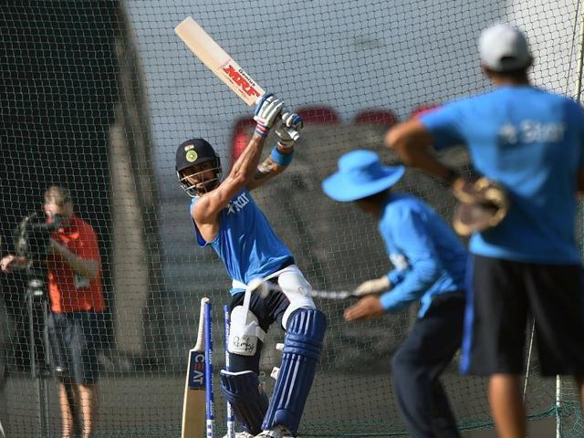 Indian cricket team director, Ravi Shastri, right, explains a point to Indian player Rohit Sharma during a practice session. (AP Photo) Indian cricket team director, Ravi Shastri, right, explains a point to Indian player Rohit Sharma during a practice session. (AP Photo)