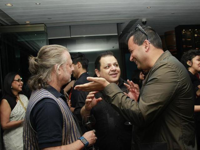 Rohit Bal and Rohit Gandhi with another guest. (Shivam Saxena/Hindustan Times) 
