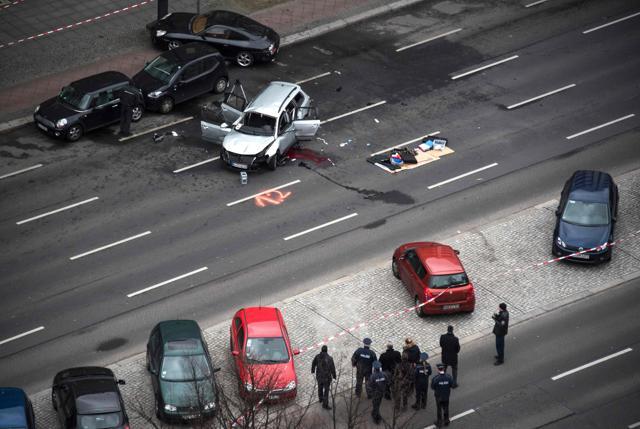 Photos from the scene showed the wreckage of a Berlin-registered silver VW Passat station wagon, its windows blown out and its front end smashed in, about a kilometer (half mile) from the capital’s landmark Victory Column. (AFP) Photos from the scene showed the wreckage of a Berlin-registered silver VW Passat station wagon, its windows blown out and its front end smashed in, about a kilometer (half mile) from the capital’s landmark Victory Column. (AFP)