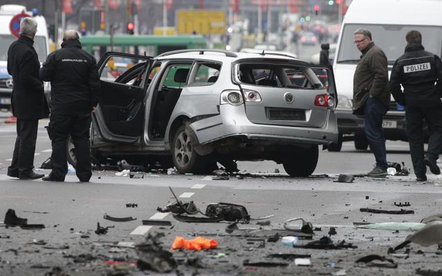 A picture posted by Berlin police on Twitter showed the wreckage of a silver VW Passat station wagon on the street, its windows blown out. (AP) A picture posted by Berlin police on Twitter showed the wreckage of a silver VW Passat station wagon on the street, its windows blown out. (AP)