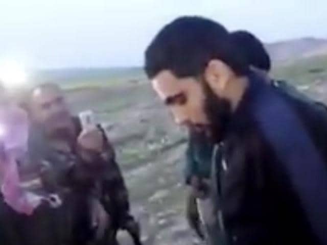 This image made from video posted on Twitter by a Kurdish fighter shows a man that the Kurdish military says is an American member of the Islamic State group shortly after he turned himself in to Kurdish fighters in northern Iraq, Monday, March 14, 2016. (AP) This image made from video posted on Twitter by a Kurdish fighter shows a man that the Kurdish military says is an American member of the Islamic State group shortly after he turned himself in to Kurdish fighters in northern Iraq, Monday, March 14, 2016. (AP)
