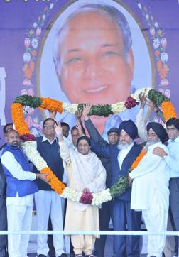 BSP workers garlanding Mayawati during a rally on the birth anniversary of BSP founder Kanshi Ram at SBS Nagar (Nawanshahr) on Tuesday. (Pardeep Pandit/HT Photo) BSP workers garlanding Mayawati during a rally on the birth anniversary of BSP founder Kanshi Ram at SBS Nagar (Nawanshahr) on Tuesday. (Pardeep Pandit/HT Photo)