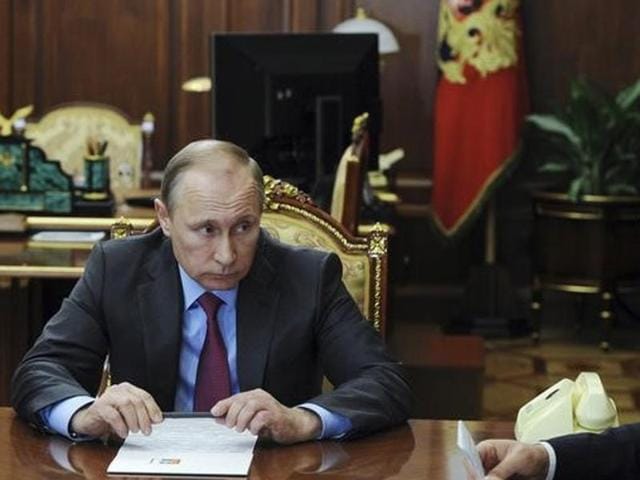 Russian President Vladimir Putin, right, listens to Russian Foreign Minister Sergey Lavrov during their meeting in the Kremlin in Moscow, Russia (AP) Russian President Vladimir Putin, right, listens to Russian Foreign Minister Sergey Lavrov during their meeting in the Kremlin in Moscow, Russia (AP)
