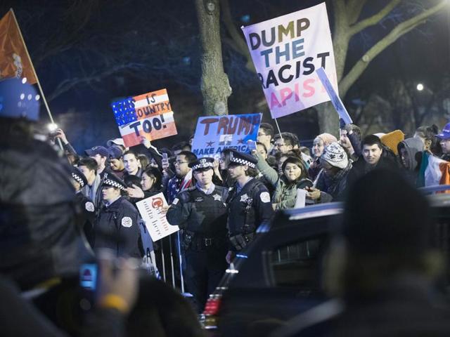 Demonstrators taunt supporters of Republican presidential candidate Donald Trump as they leave a rally at the University of Illinois at Chicago. (AFP) Demonstrators taunt supporters of Republican presidential candidate Donald Trump as they leave a rally at the University of Illinois at Chicago. (AFP)