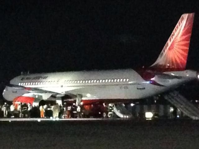 The airline crew deployed emergency chutes to evacuate passengers from the left door of the aircraft. The airline crew deployed emergency chutes to evacuate passengers from the left door of the aircraft.