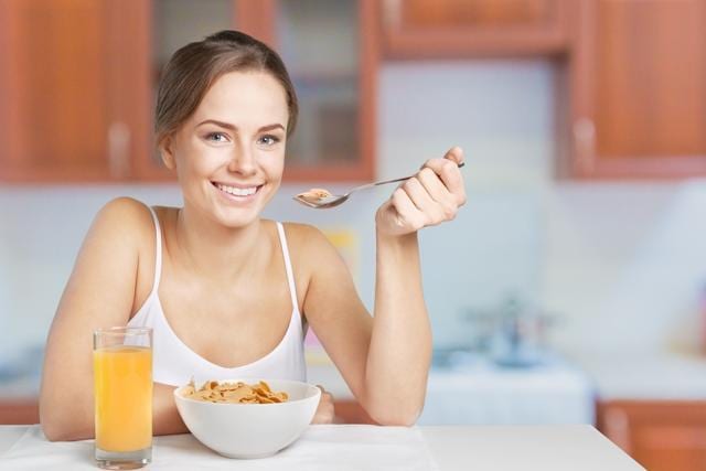 Watching loud TV or listening to loud music while eating can mask eating sounds that keep you in check. (Shutterstock) Watching loud TV or listening to loud music while eating can mask eating sounds that keep you in check. (Shutterstock)