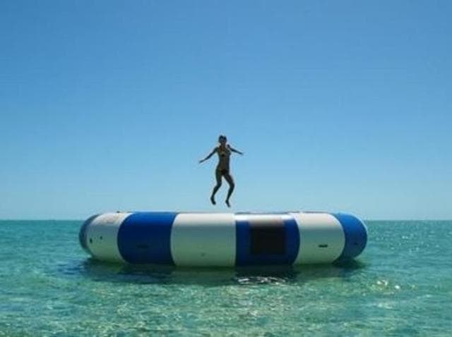 The 26-year-old also jumped on one of those water trampolines and  belly flopped into the sea before shouting, “It hurt a lot!” (Instagram) 