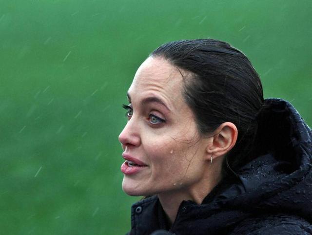 Jolie greeted children and asked the throng of reporters, cameramen and photographers to be more “thoughtful” as she tried to speak with them.(AP)