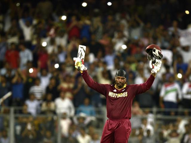 Gayle raises his bat in celebration of his century. (Arijit Sen/HT Photo) Gayle raises his bat in celebration of his century. (Arijit Sen/HT Photo)