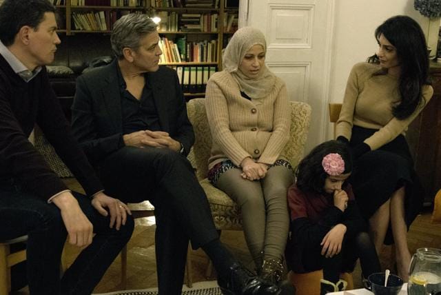 IRC President and CEO David Miliband (L) George Clooney (2nd L), and Amal Clooney (R) meet with Syrian refugees Mona and her daughter, 11-year-old Joudi, in Berlin. The group discussed what their life was like in Syria, the reasons they felt they needed to uproot their families, and their futures in Germany. (REUTERS) IRC President and CEO David Miliband (L) George Clooney (2nd L), and Amal Clooney (R) meet with Syrian refugees Mona and her daughter, 11-year-old Joudi, in Berlin. The group discussed what their life was like in Syria, the reasons they felt they needed to uproot their families, and their futures in Germany. (REUTERS)