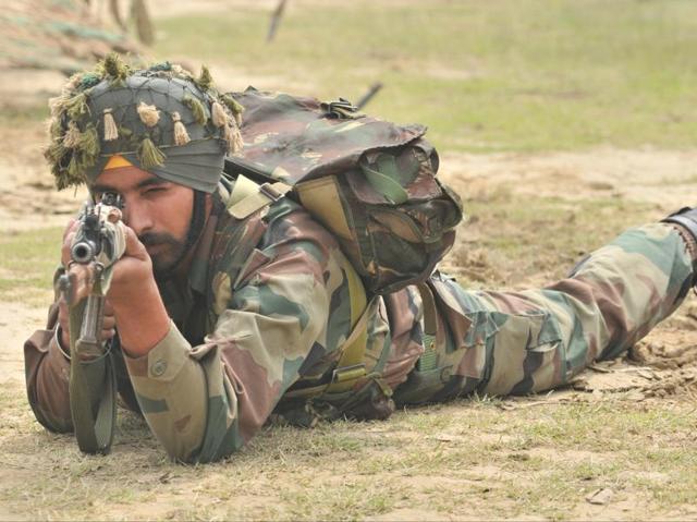 A soldier targeting on an enemy during an exhibition of tank battles and ammunition at Lovely Professional University, on the outskirts of Jalandhar, on Wednesday. (Pardeep Pandit/HT Photo)