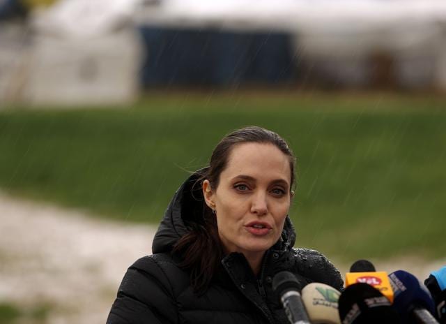Angelina Jolie speaks during a press conference under the rain as part of her visit at a Syrian refugee camp near the city of Zahle in Lebanon's Bekaa Valley on March 15. (AFP) Angelina Jolie speaks during a press conference under the rain as part of her visit at a Syrian refugee camp near the city of Zahle in Lebanon's Bekaa Valley on March 15. (AFP)
