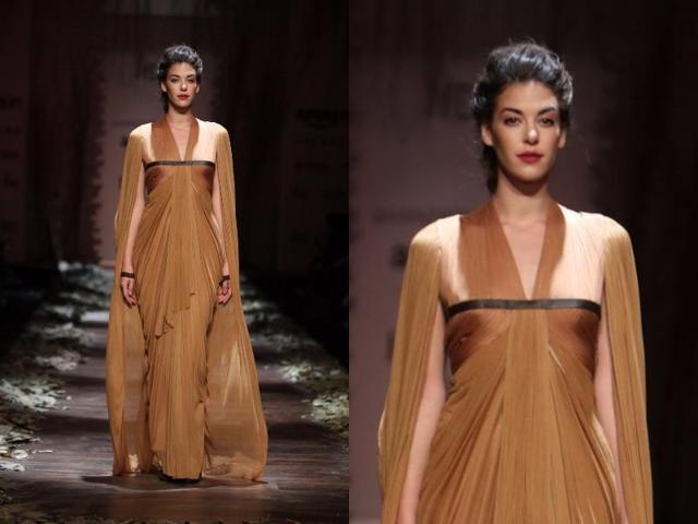 This toffee-caramel coloured ensemble was studded with a cape at Shantanu-Nikhil. (Raajessh Kashyap/HT Photo) This toffee-caramel coloured ensemble was studded with a cape at Shantanu-Nikhil. (Raajessh Kashyap/HT Photo)