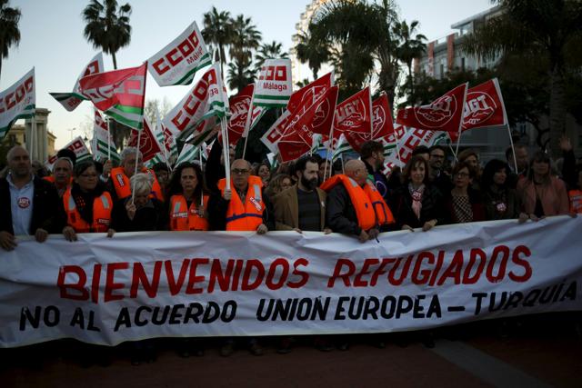 People hold a banner during a protest against the EU-Turkey migrant deal in Malaga. (REUTERS) People hold a banner during a protest against the EU-Turkey migrant deal in Malaga. (REUTERS)