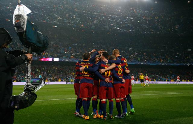 Barcelona players celebrate their second goal against Arsenal. (AP) Barcelona players celebrate their second goal against Arsenal. (AP)