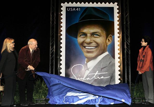 In this December 12, 2007 file photo, Frank Sinatra's children, (from left, Nancy Sinatra, Frank Jr and Tina), unveil a 10-ft image of the Frank Sinatra commemorative postal stamp during a ceremony commemorating Sinatra's 92nd birthday, in Beverly Hills, California. Frank Sinatra Jr, who carried on his famous father's legacy with his own music career, died unexpectedly of cardiac arrest while on tour Wednesday, March 16, 2016, his family said. He was 72. (AP) In this December 12, 2007 file photo, Frank Sinatra's children, (from left, Nancy Sinatra, Frank Jr and Tina), unveil a 10-ft image of the Frank Sinatra commemorative postal stamp during a ceremony commemorating Sinatra's 92nd birthday, in Beverly Hills, California. Frank Sinatra Jr, who carried on his famous father's legacy with his own music career, died unexpectedly of cardiac arrest while on tour Wednesday, March 16, 2016, his family said. He was 72. (AP)