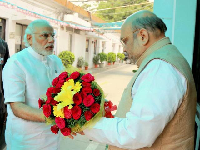 Prime Minister Narendra Modi being welcomed by BJP president Amit Shah at party office in New Delhi ahead of CEC meeting for West Bengal and Kerala on Thursday. (PTI) Prime Minister Narendra Modi being welcomed by BJP president Amit Shah at party office in New Delhi ahead of CEC meeting for West Bengal and Kerala on Thursday. (PTI)