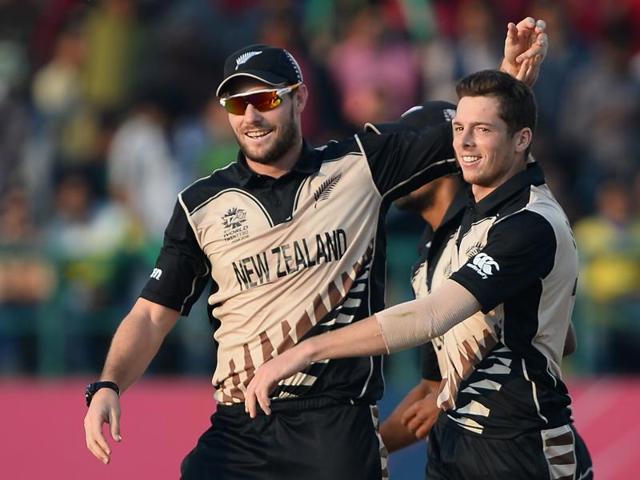 New Zealand's Mitchell Santner (R) celebrates with teammate New Zealand's Martin Guptill. (AFP Photo) 