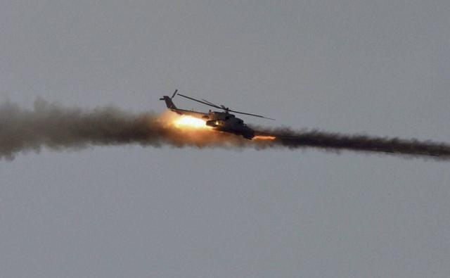 An Indian Air Force chopper demonstrates its combat capabilities in Pokhran. (PTI Photo) An Indian Air Force chopper demonstrates its combat capabilities in Pokhran. (PTI Photo)
