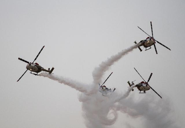 An Indian Air Force team flies advanced light helicopters. (AP Photo) An Indian Air Force team flies advanced light helicopters. (AP Photo)