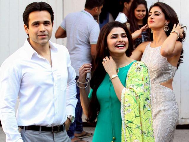 Nargis Fakhri, Emraan Hashmi and Prachi Desai pose for a photoshoot for upcoming biographical film Azhar in Mumbai on March 17, 2016. (AFP)