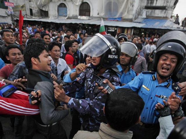 In this file photo from December 2015, Nepalese policemen use teargas to disperse ethnic Madhesi protesters in Gaur town south of Kathmandu.(AP File Photo) In this file photo from December 2015, Nepalese policemen use teargas to disperse ethnic Madhesi protesters in Gaur town south of Kathmandu.(AP File Photo)