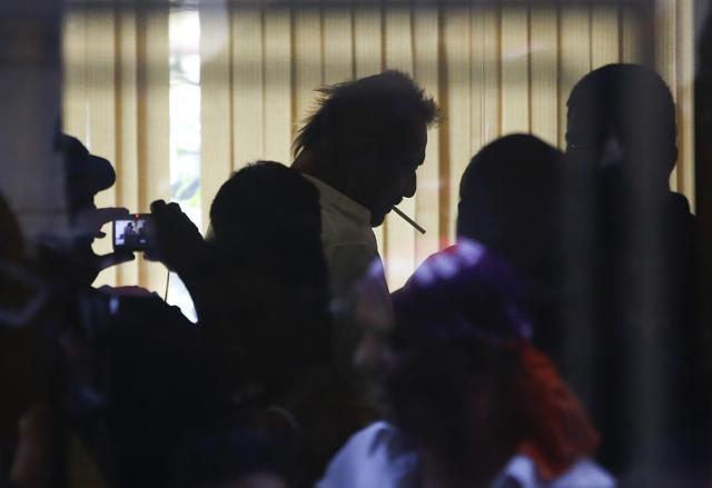 Bollywood actor Sanjay Dutt puts a cigarette in his mouth after arriving at his residence in Mumbai after being set free. (AP) Bollywood actor Sanjay Dutt puts a cigarette in his mouth after arriving at his residence in Mumbai after being set free. (AP)